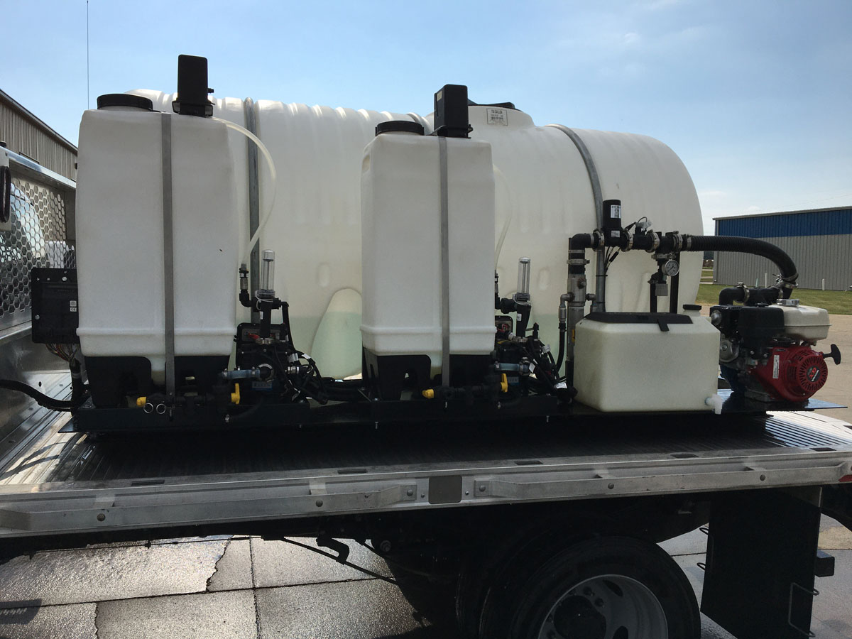 Benco Roadside Spray truck with multiple chemical tanks